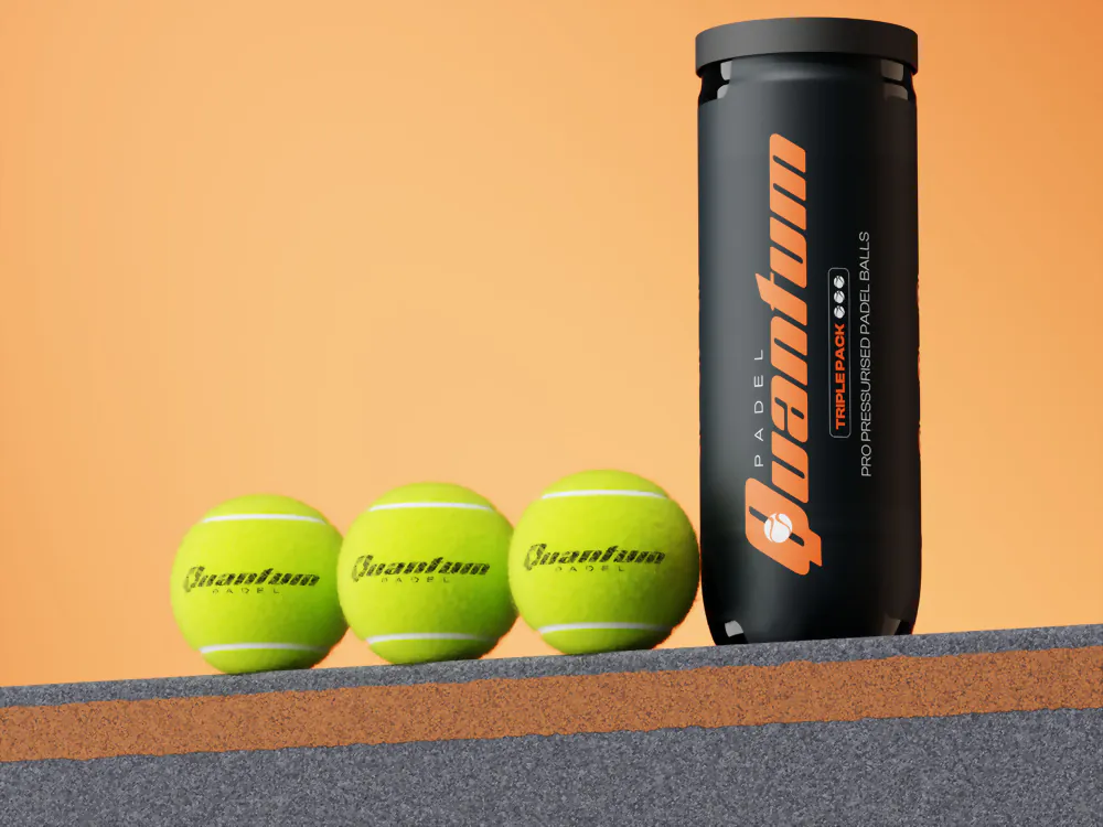 Black padel ball tube standing beside three yellow padel balls on an orange background